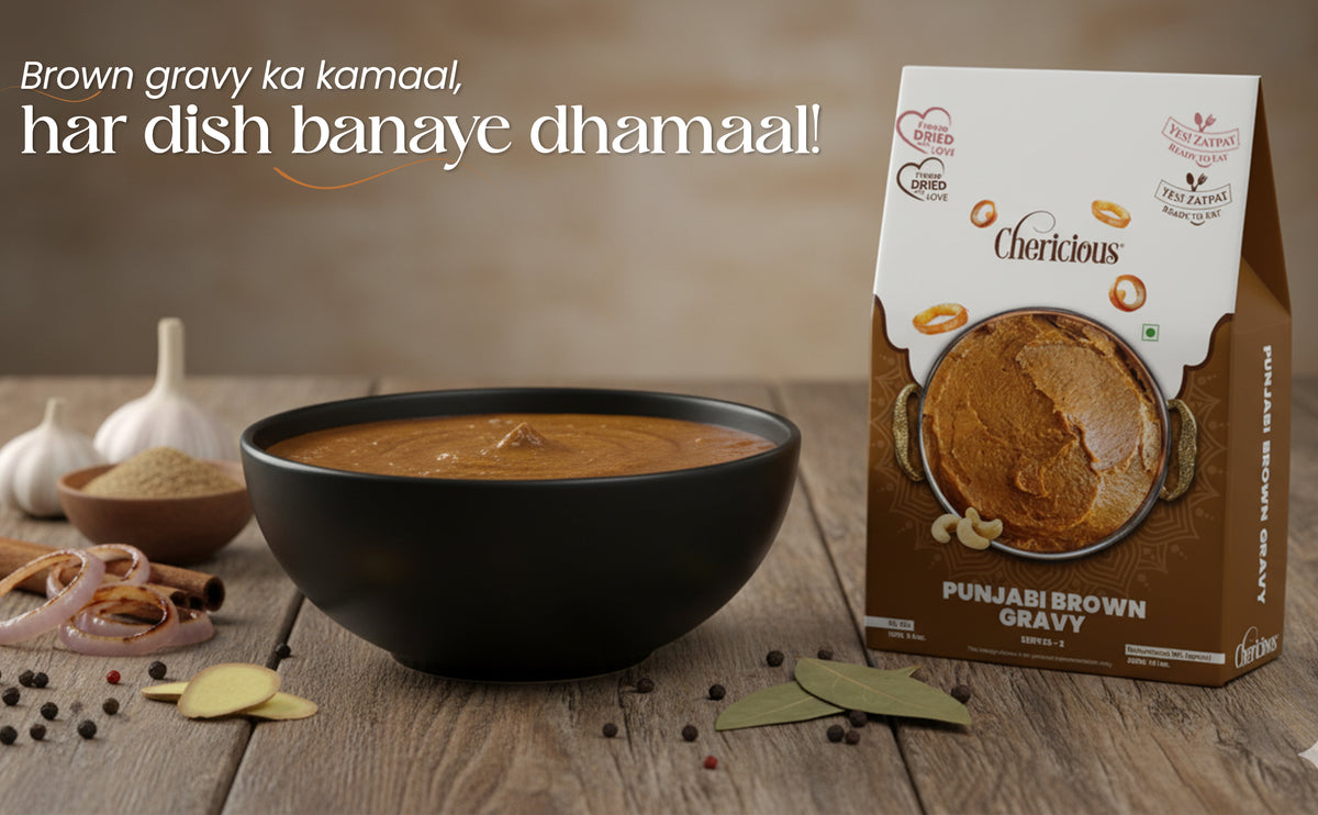 Punjabi brown gravy in a bowl with a box of the product on a wooden surface.