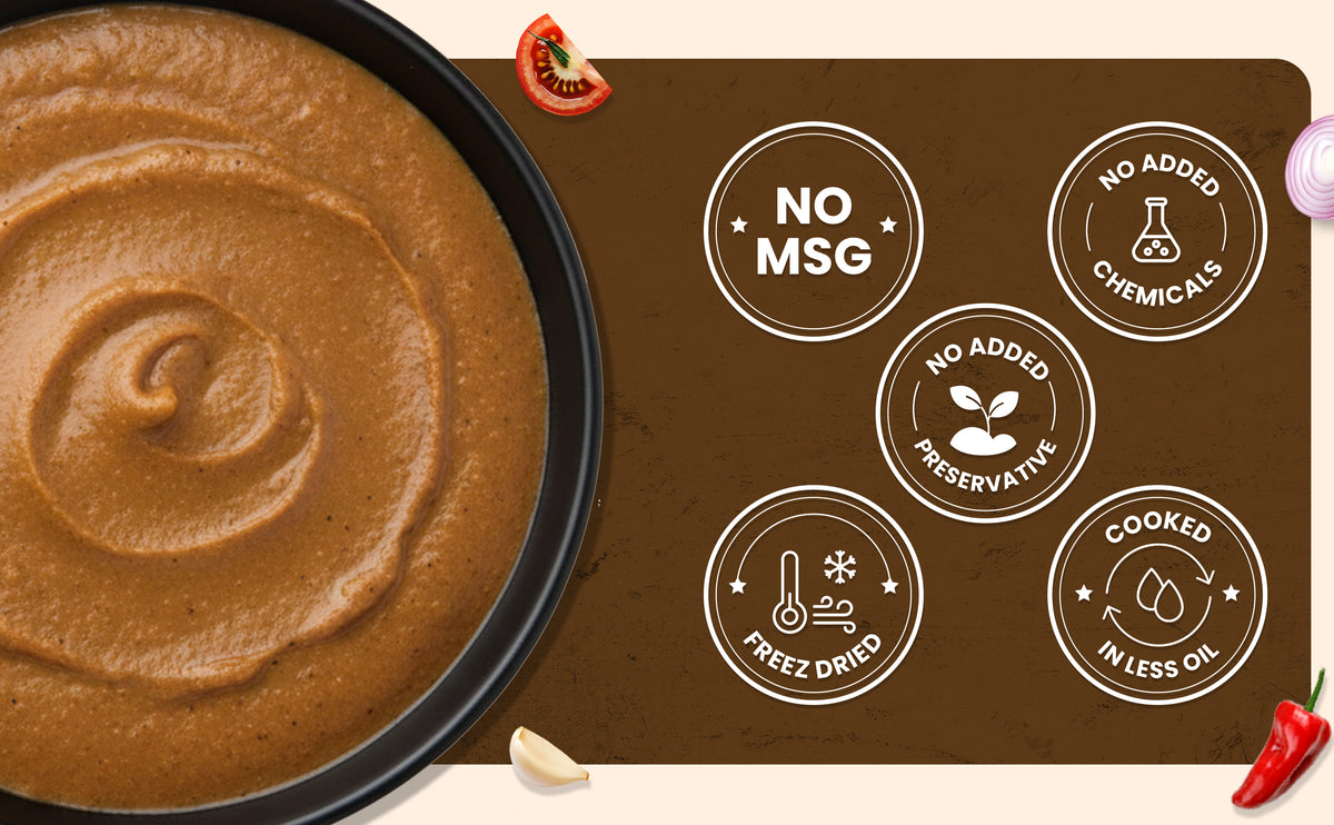 Dip with a brown sauce in a black bowl next to a brown mat with health claims on it.