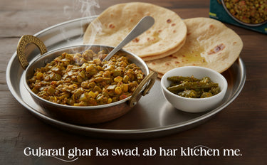 Gujarati food platter with dal, roti, and green beans on a tray.