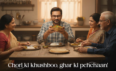 Family gathered around a table for a meal in a kitchen setting.