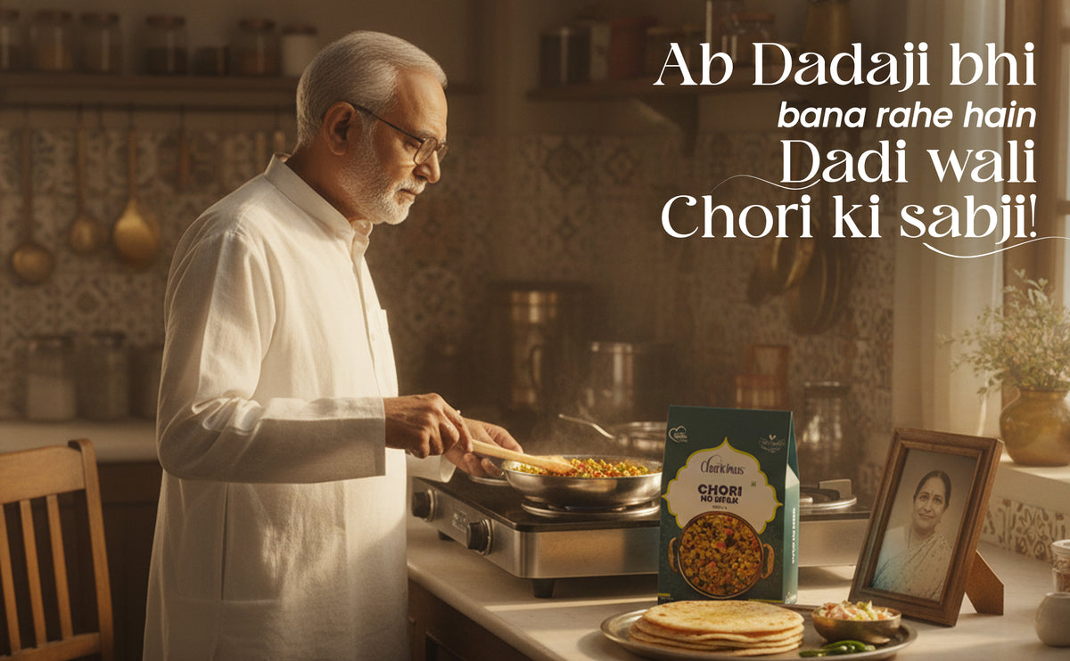 Man cooking in a kitchen with a box of Chori on the counter.