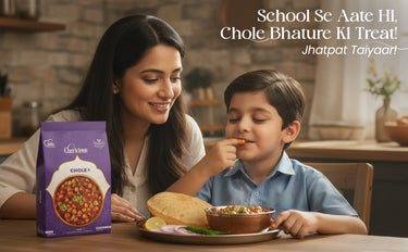 Woman and child enjoying a meal together with a Cirkles Chole Bhature package on the table.