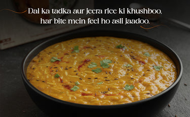Bowl of dal ka tadka aur jeera rice with text overlay on a dark background
