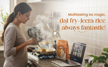 Woman cooking in a kitchen with a laptop and dal jeera rice package.