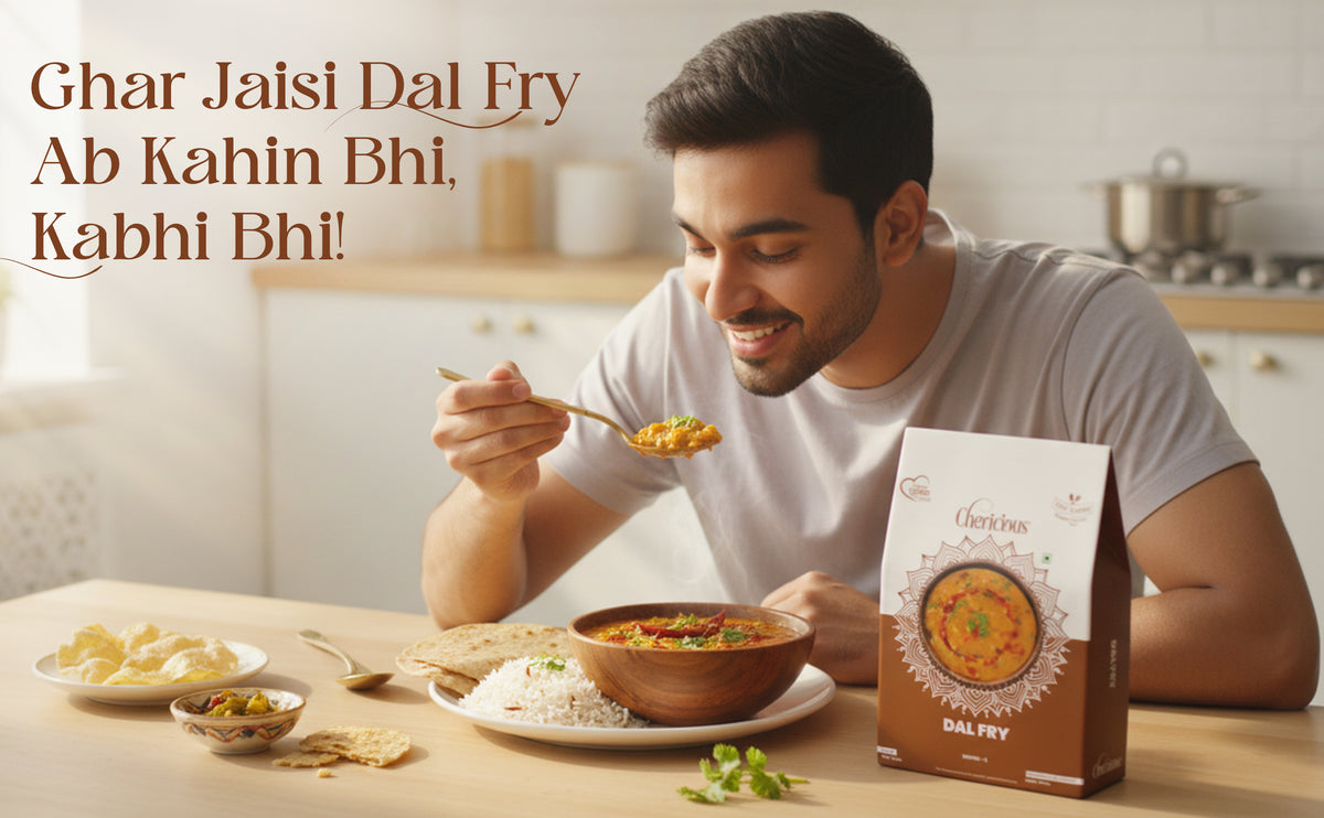 Man eating dal fry with a box of Dal Fry on a table, kitchen background