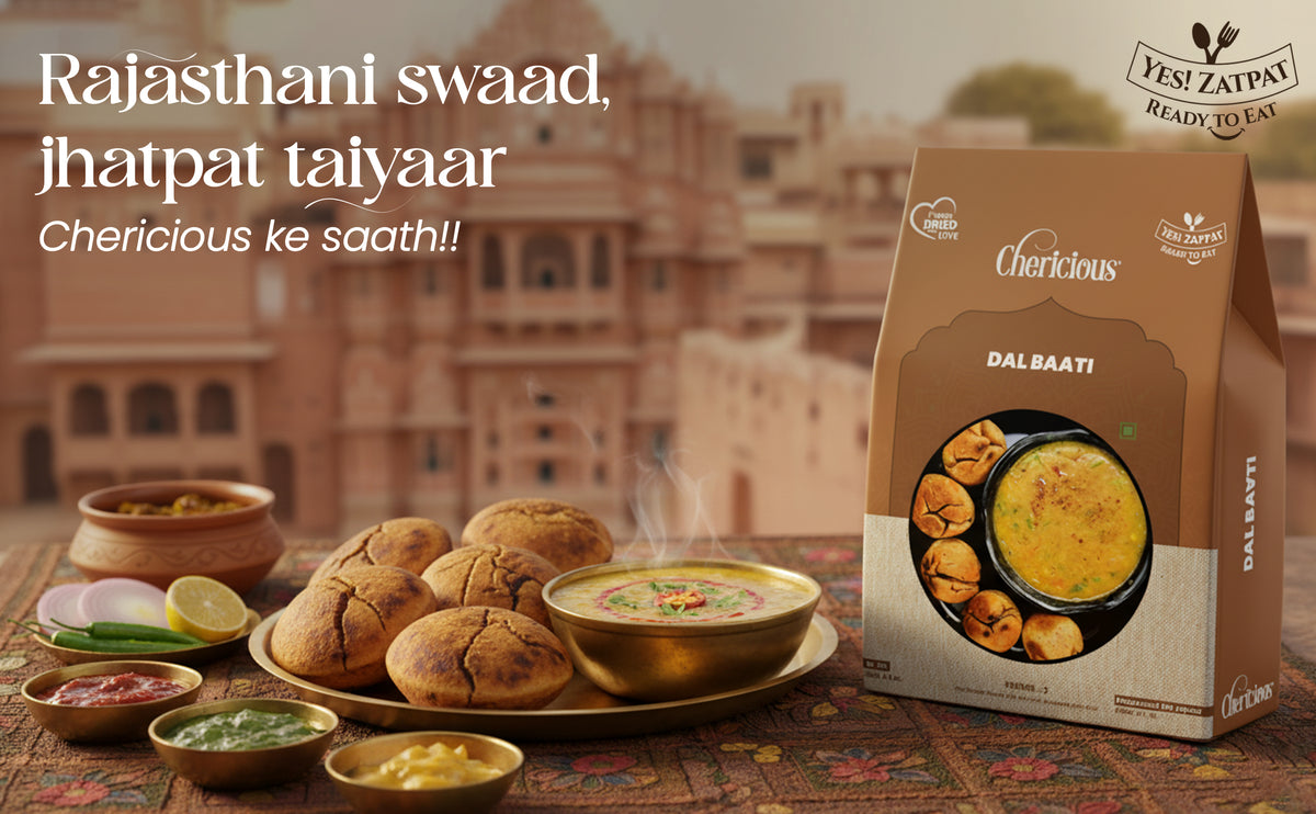 Dal baati with Rajasthani spices and a 'Cherlicious' packaging in front of a traditional building.