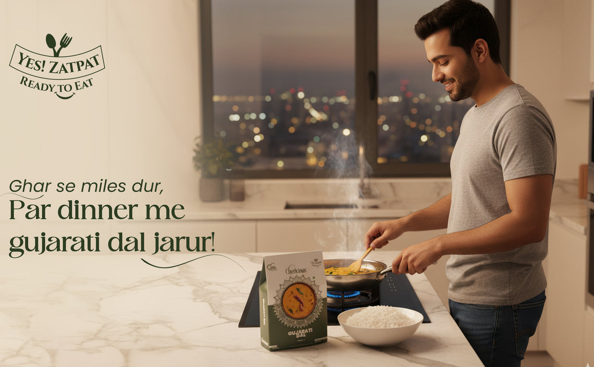 Man cooking in a kitchen with a window view of a cityscape, featuring Yes! Zatarain's Gujarati dal packaging.