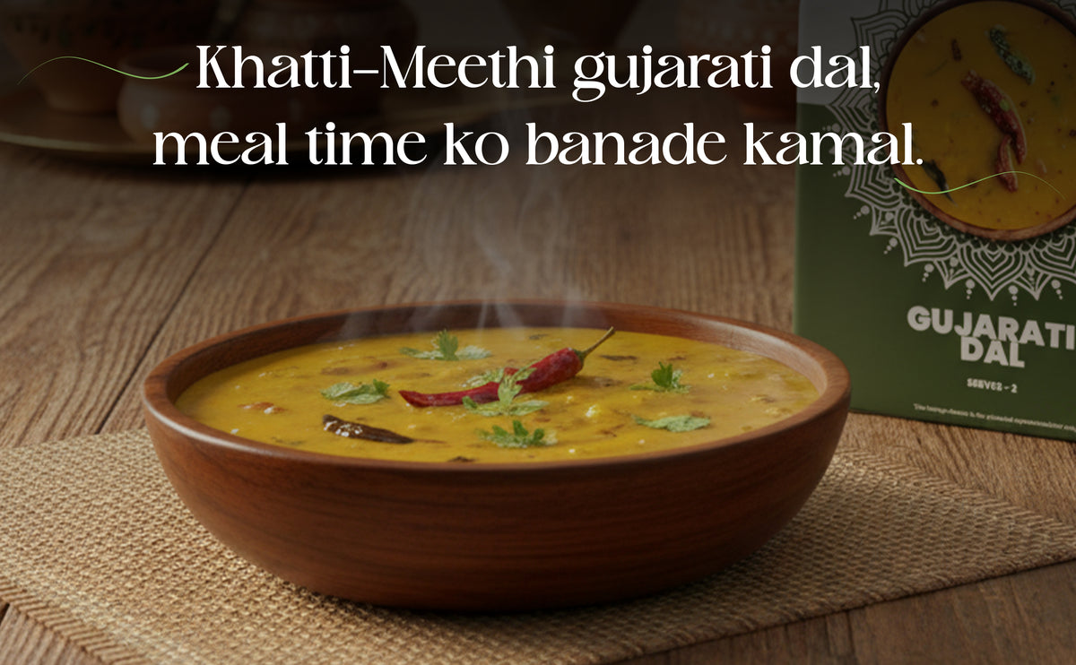 Bowl of Gujarati dal with text on a wooden surface