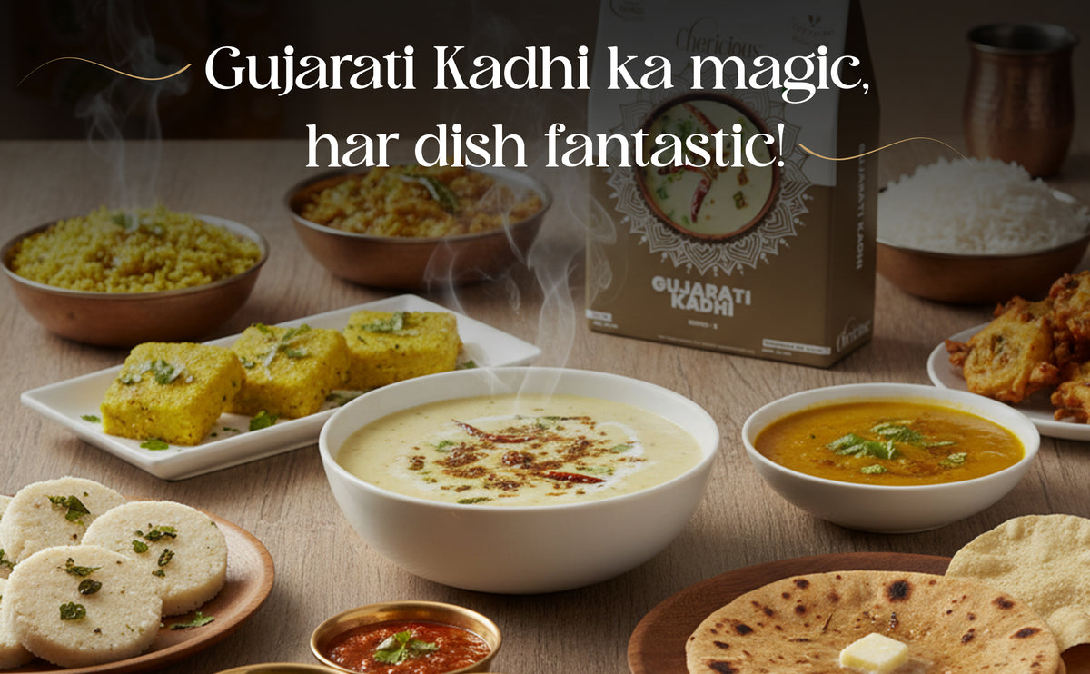 Gujarati Kadhi dish with various food items on a table, featuring a box of Gujarati Kadhi.