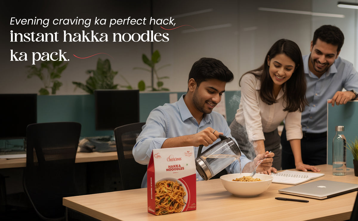 People in an office setting with instant hakka noodles packaging.