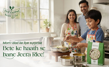 Family in a kitchen with a child cooking Jeera Rice, featuring Yesi Zatpat brand.