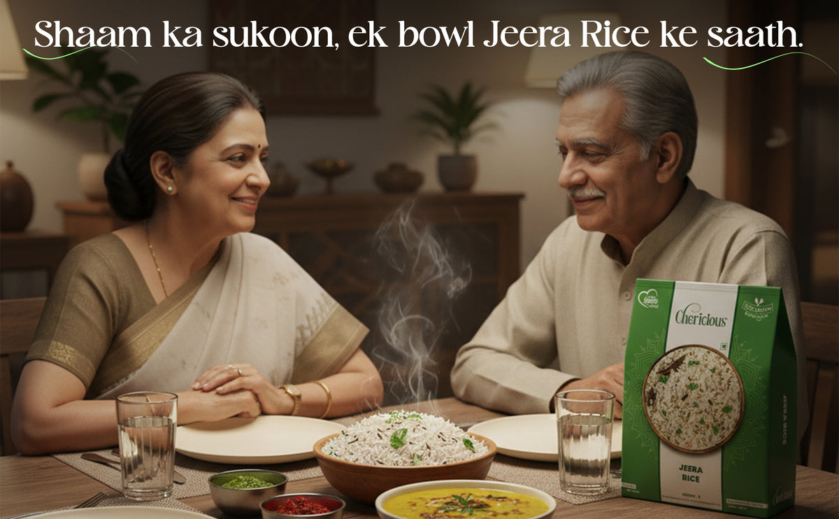 Two people sitting at a table with a bowl of Jeera Rice and a box of Cherished Moments Jeera Rice, with text overlay.
