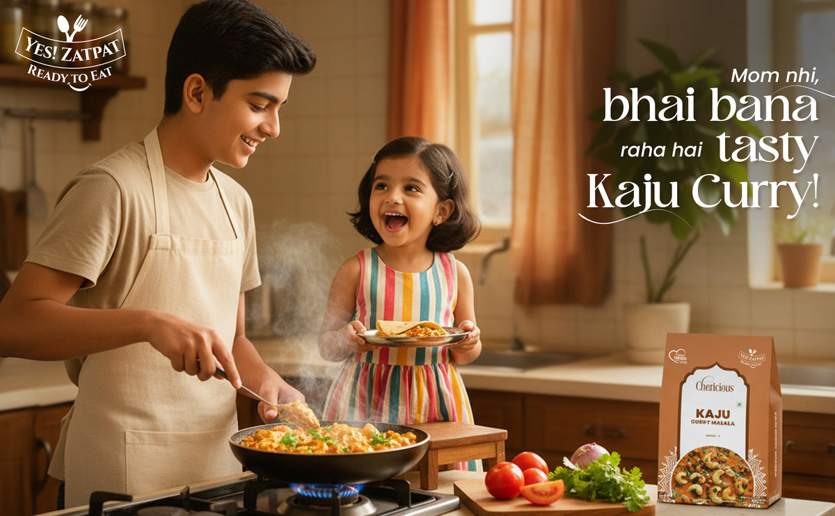 Man and child cooking Kaju Curry in a kitchen with a Kaju brand package.