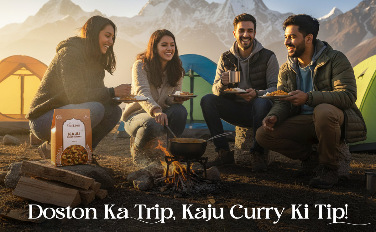 Group of people camping with a fire, enjoying food, and a box of Kaju Curry in the foreground.