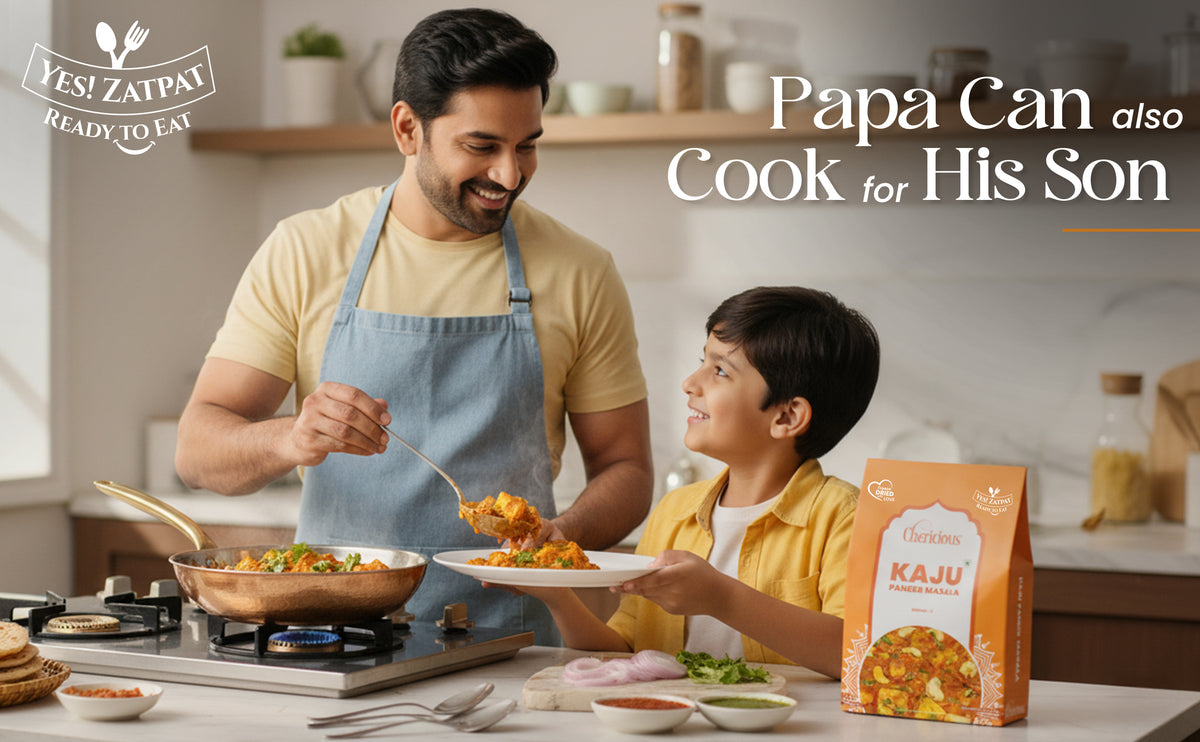 Man and child cooking together in a kitchen with Kaju packaging displayed.