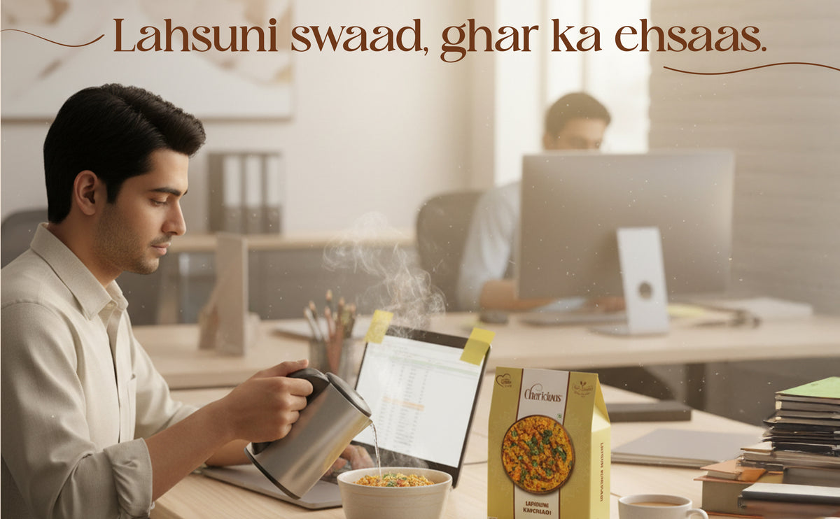 Person using a tablet with a box of cereal on a desk, with another person in the background.