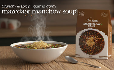 Manchow soup with a steaming bowl and a box labeled 'Cherlicious Manchow Soup' on a wooden table.