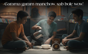 Three people sitting on the floor cooking food with steam rising, text overlay 'Garama garam manchow, sab hole wow!'.