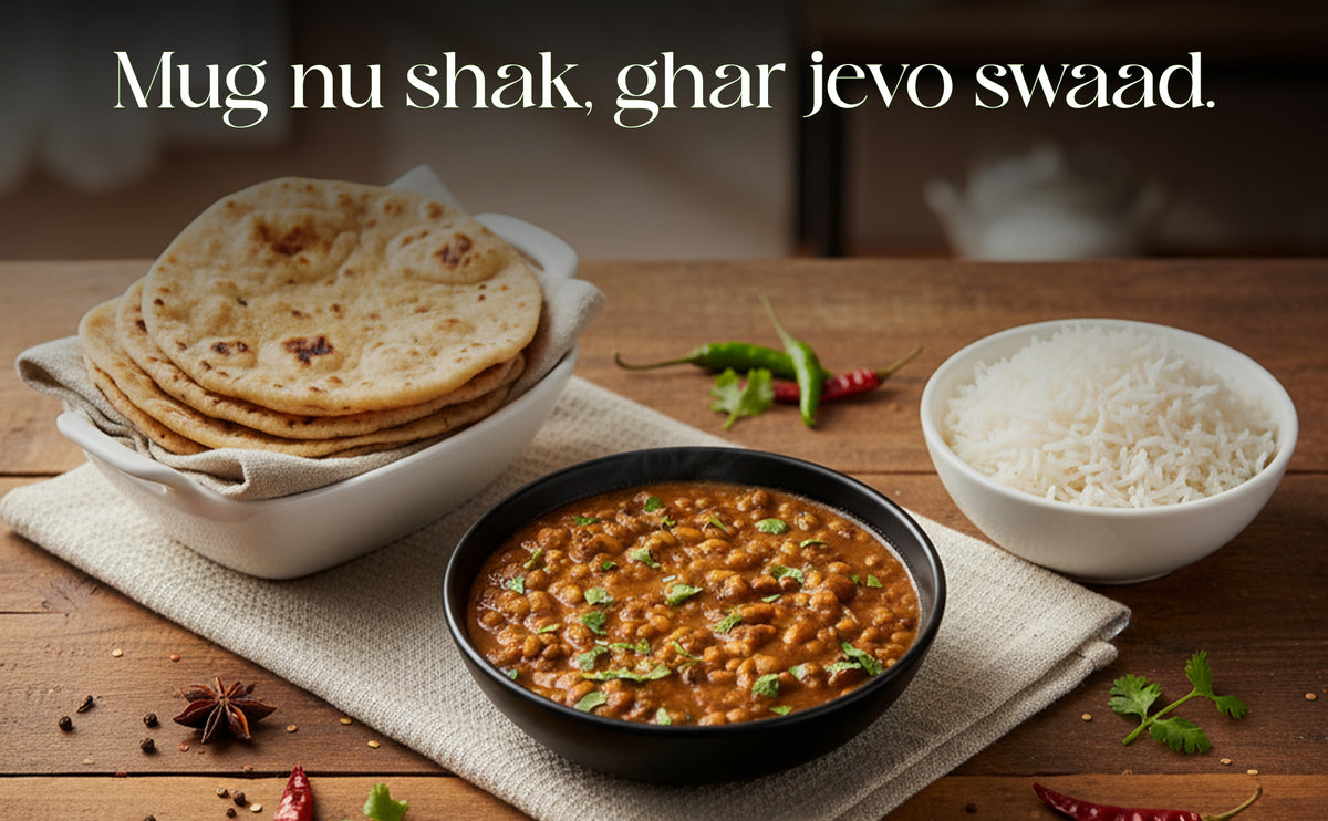 Dishes of food including rice, flatbreads, and a bowl of curry on a wooden table with text overlay.