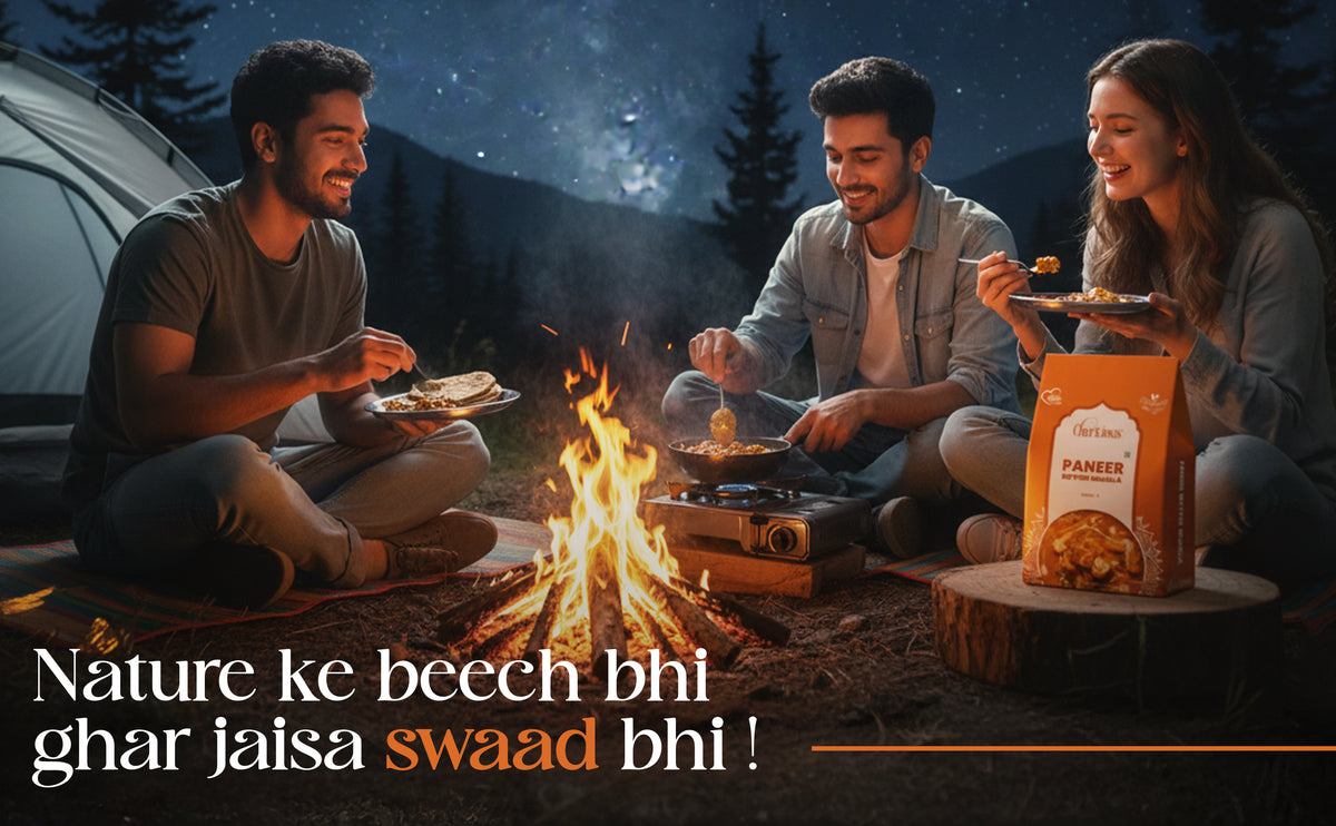 People camping outdoors by a fire, enjoying food with text overlay.