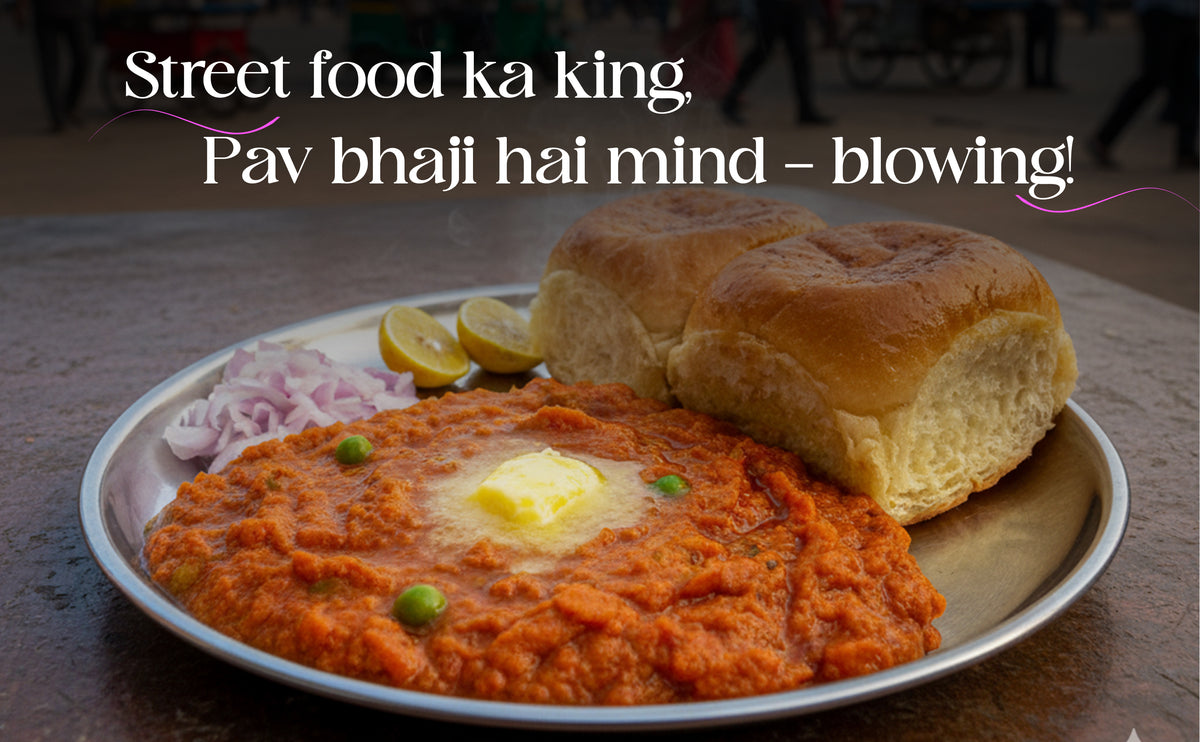 Plate of Pav bhaji with a bun, lemon, and onions on a wooden table.