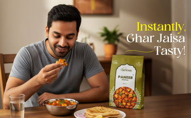Man eating food with a package of Clarion's Paneer in a kitchen setting