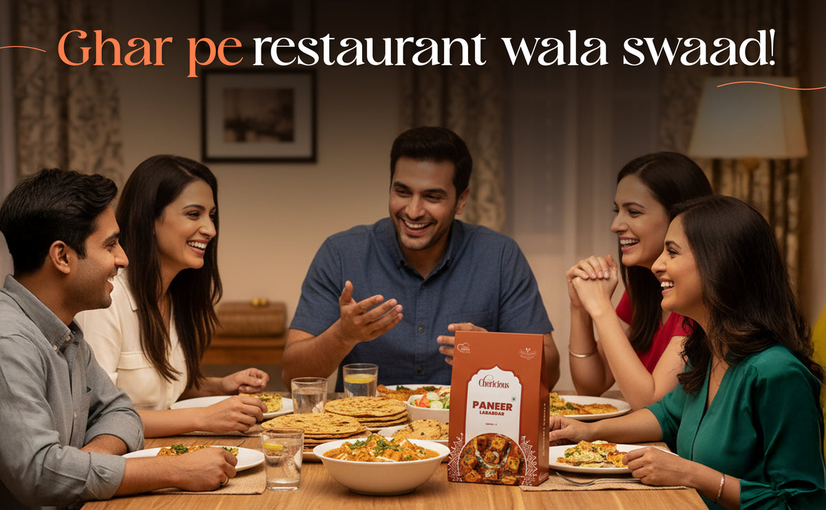 People enjoying a meal together with a package of Paneer in the center.