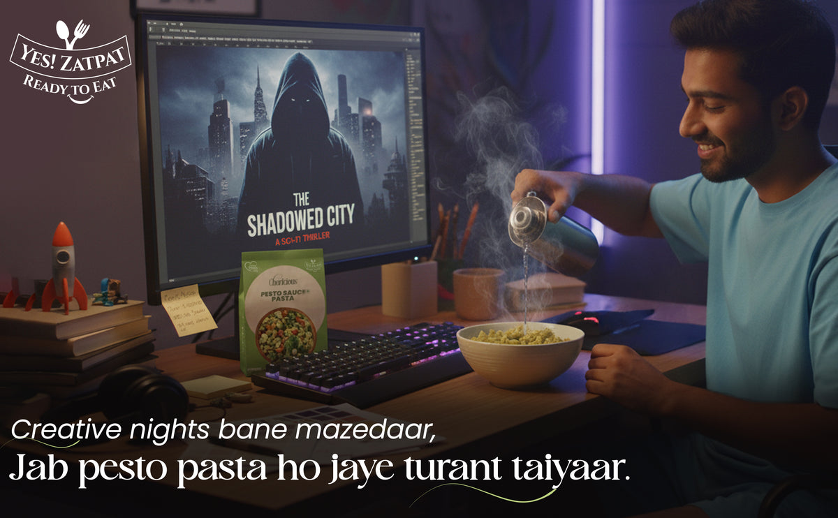 Man cooking pasta in front of a computer screen with Zomato branding.