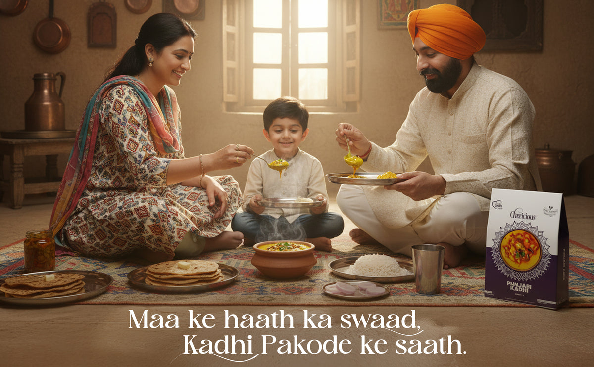 Family sitting together with food on a table, with a box of 'Vikas' brand product in the foreground.