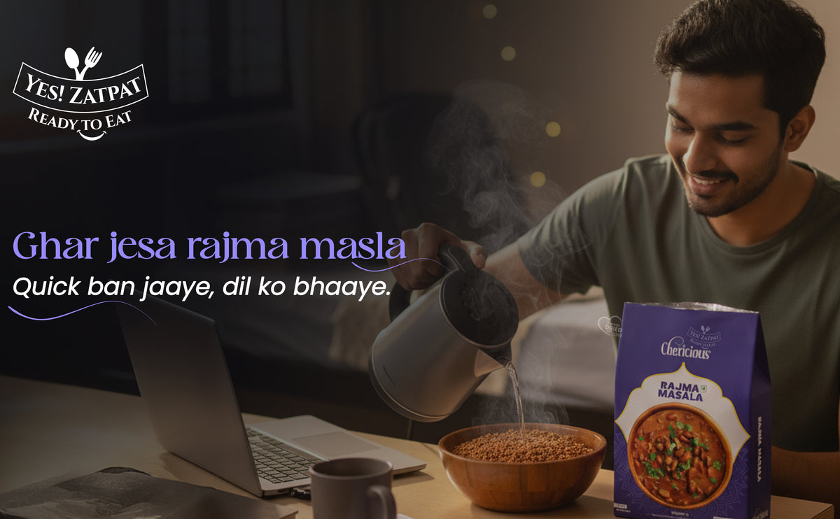Man preparing a meal with a laptop, bowl of Rajma Masala, and Zafar brand packaging.
