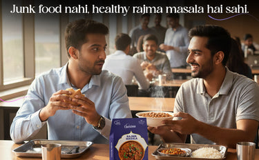 Two men sitting at a table with food and a 'Kadai Masala' box, with text promoting healthy eating.
