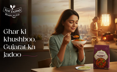 Woman enjoying a meal with Yeshi Zatpay packaging in a cozy kitchen setting.