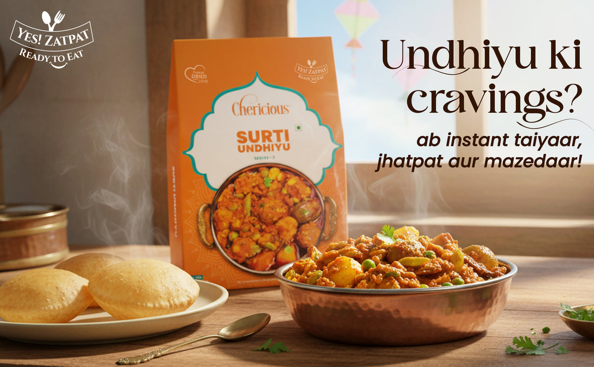 Surti Undhiyu packaging with a bowl of undhiyu and steamed buns on a wooden table.