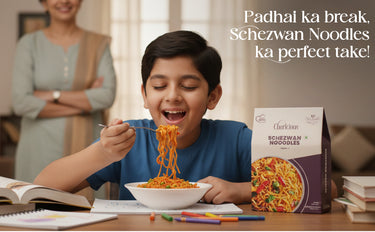 Child eating noodles with a box of Schezwan Noodles and a woman in the background.