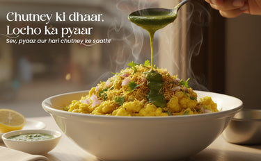 Bowl of food with green chutney being poured over it, steam rising
