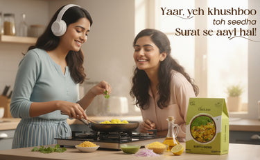Two women cooking together in a kitchen with a box of Chhota Bheem on the counter.