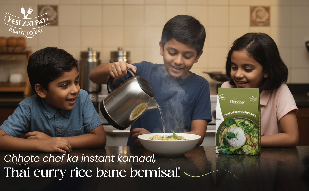 Three children in a kitchen setting with a box of Thai green curry rice mix.