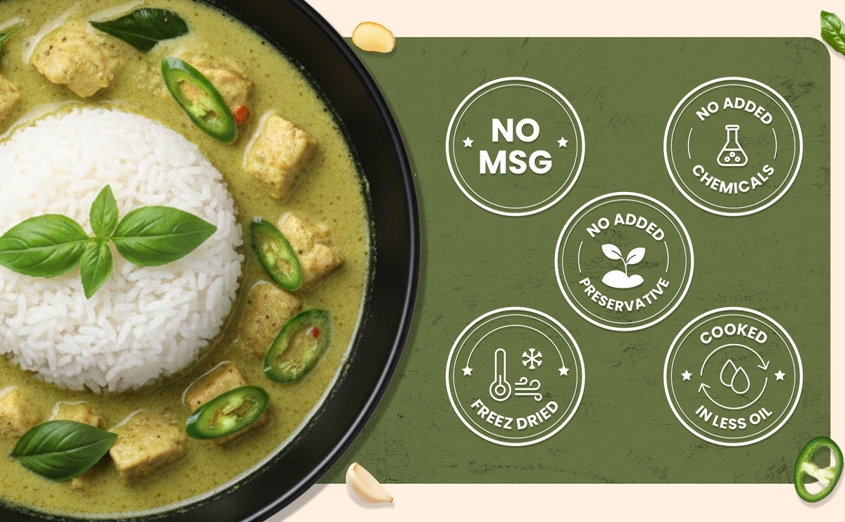 Green curry with rice and vegetables on a black plate, featuring icons indicating no MSG, no added chemicals, and other health benefits on a green background.