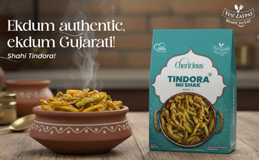Bowl of Tindora with a box labeled 'Cherlicious Tindora Nu Shak' on a wooden surface.