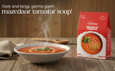 Bowl of mazedaar tamatar soup with a box on a wooden table