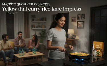 Woman cooking yellow Thai curry rice in a pan with friends watching in a living room.