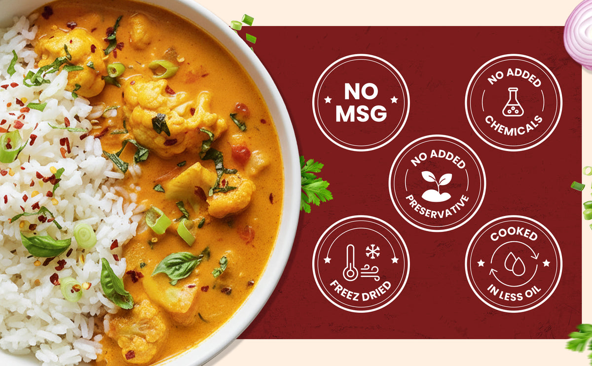 Curry dish with rice and a label indicating no MSG, no added chemicals, no added preservatives, cooked in less oil.