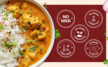 Curry dish with rice and a label indicating no MSG, no added chemicals, no added preservatives, cooked in less oil.