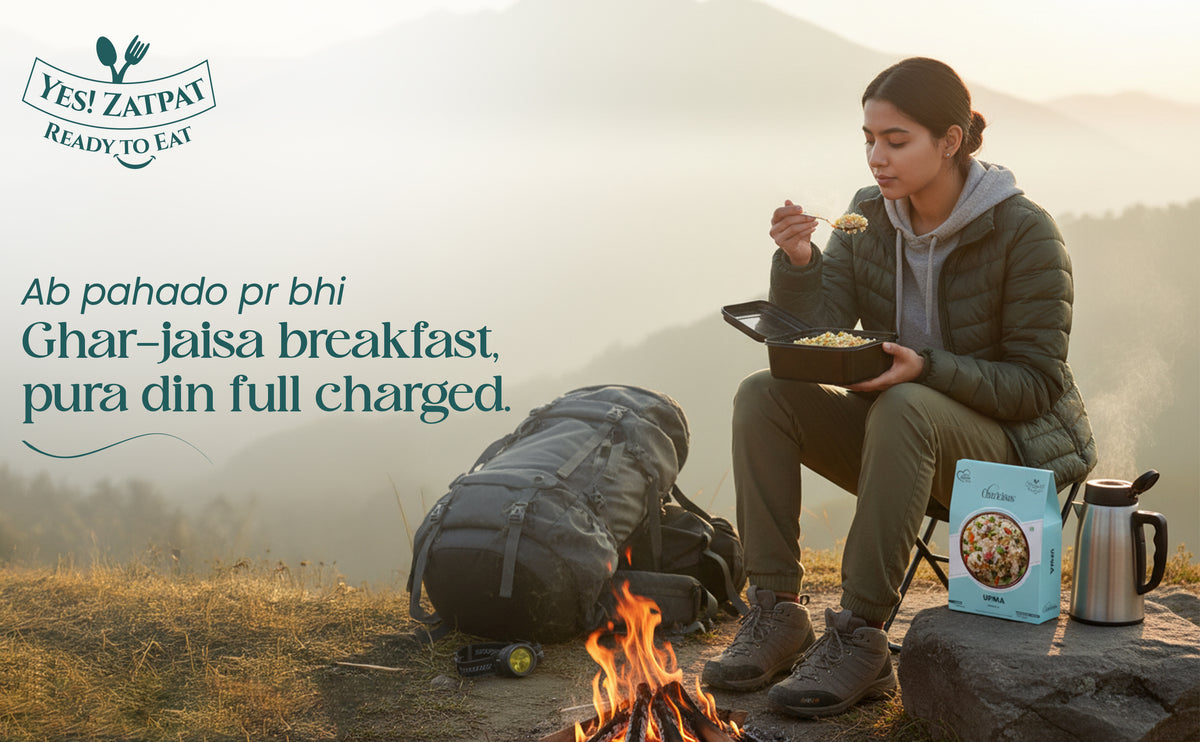 Person eating outdoors by a campfire with Yes! Zatpat packaging and branding.