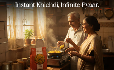 Two people cooking together in a kitchen with a box of Khichdi in the foreground.