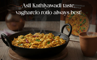 Steaming dish of Kathiyawadi food with text about its taste, on a wooden table.