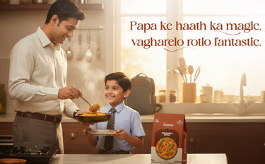 Man and child in a kitchen with a Swad brand food product box.