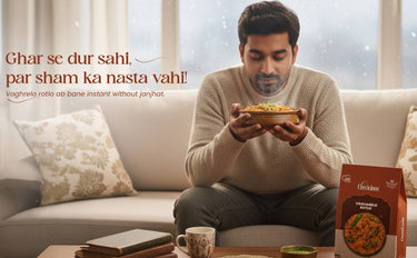 Man sitting on a couch holding a bowl of food with a box of instant noodles next to him.