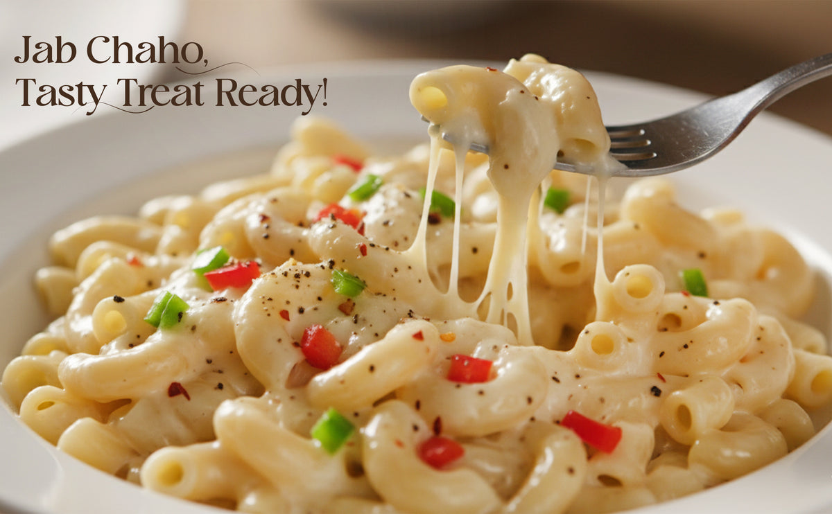 Macaroni and cheese with a fork lifting a portion, text 'Jab Chaho. Tasty Treat Ready!' above.