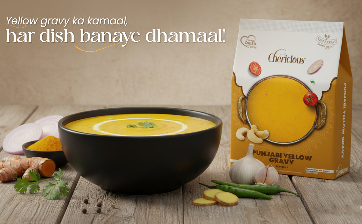 Punjabi yellow gravy in a bowl with a box of the product on a wooden surface.